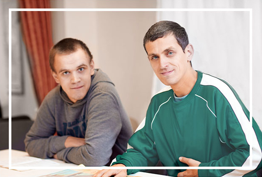 2 Weston Bridges residents sitting at a table